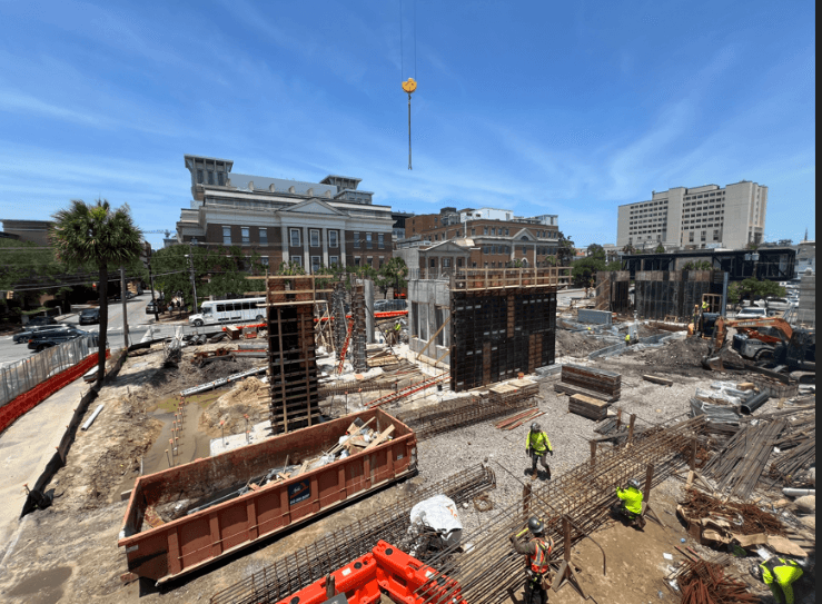 digging trenches and placing rebar, laying the critical groundwork that will support the structure